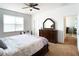 Bedroom featuring a ceiling fan, and a dresser with a mirror at 6320 Sw 74Th Terrace Rd, Ocala, FL 34474