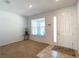 Entryway with carpeted living area, natural light, and tile flooring at 6320 Sw 74Th Terrace Rd, Ocala, FL 34474