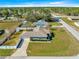 Aerial view of the home showcasing the fenced-in backyard and surrounding neighborhood at 7398 Hemlock Rd, Ocala, FL 34472