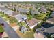 Aerial view of the property showcasing the home's layout and mature landscaping at 805 Pickett Rd, The Villages, FL 32163