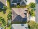 An aerial view of the home's roof, landscaping, driveway, and positioning within the community at 805 Pickett Rd, The Villages, FL 32163