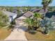 Bird's eye view of the home surrounded by mature trees and professionally maintained landscaping at 805 Pickett Rd, The Villages, FL 32163