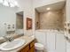 Accessible bathroom with a walk-in tub, vanity, and decorative towels and artwork at 805 Pickett Rd, The Villages, FL 32163