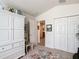 Bedroom featuring a neutral color palette, large closet, and views of other rooms through doorways at 805 Pickett Rd, The Villages, FL 32163