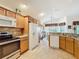 Kitchen featuring stainless appliances and views into the dining area at 805 Pickett Rd, The Villages, FL 32163