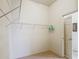 Simple walk-in closet with shelving and a view through the open door to a tiled floor at 805 Pickett Rd, The Villages, FL 32163