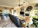 Relaxing living room with tile floors, a ceiling fan, and a fireplace at 8585 Nw 162Nd Ct, Morriston, FL 32668