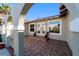 Inviting front porch with patterned tile flooring, arched entryways, and double glass doors at 8947 Se 70Th Ter, Ocala, FL 34472