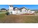 Exterior view of a charming house with a landscaped front yard and a white fence at 8947 Se 70Th Ter, Ocala, FL 34472