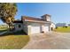 Detached garage with multiple bays featuring a unique cupola architectural design at 8947 Se 70Th Ter, Ocala, FL 34472