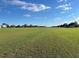 Vacant grass lot located near a private community landing strip at 8947 Se 70Th Ter, Ocala, FL 34472