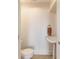 Small bathroom with a pedestal sink, tiled floor, and toilet at 905 Se 12Th St, Ocala, FL 34471