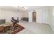 Large open room with modern lighting and neutral carpeting at 905 Se 12Th St, Ocala, FL 34471