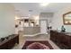 Entryway with a glimpse into the open kitchen, featuring tile flooring and neutral decor at 905 Se 12Th St, Ocala, FL 34471