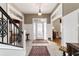 Bright foyer featuring decorative trim and elegant staircase at 905 Se 12Th St, Ocala, FL 34471