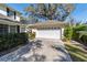 Detached two-car garage with a brick driveway and manicured landscaping at 905 Se 12Th St, Ocala, FL 34471