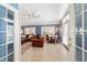 Inviting living room boasts tile floors, ceiling fan and dining area bathed in natural light at 905 Se 12Th St, Ocala, FL 34471