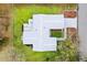 Overhead aerial view of house, deck, yard, and long driveway at 9493 Se 173Rd Ln, Summerfield, FL 34491