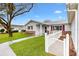 Charming home with red shutters, a brick accent wall, and well-maintained landscaping at 9493 Se 173Rd Ln, Summerfield, FL 34491