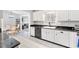 View of the kitchen with white cabinets, granite countertops, and stainless steel appliances at 9493 Se 173Rd Ln, Summerfield, FL 34491