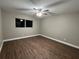 Neutral bedroom with a ceiling fan, vinyl floor, and a bright window at 9681 Sw 97Th Ln, Ocala, FL 34481