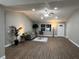 Spacious living room with hardwood floors, recessed lighting, and contemporary décor at 9681 Sw 97Th Ln, Ocala, FL 34481