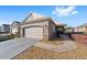 Beautiful home with a two-car garage and pretty landscaping at 9839 Sw 99Th Loop, Ocala, FL 34481