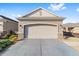 Attached two-car garage with a spacious concrete driveway at 9839 Sw 99Th Loop, Ocala, FL 34481