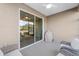 Relaxing screened porch featuring comfortable seating and a ceiling fan at 9839 Sw 99Th Loop, Ocala, FL 34481