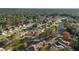 An aerial view of a residential neighborhood with mature trees, lawns and winding roads at 11569 Sw 71St Cir, Ocala, FL 34476