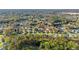 An aerial photograph of a community set among lush greenery with well-spaced homes at 11569 Sw 71St Cir, Ocala, FL 34476