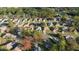 An aerial view of a residential neighborhood with mature trees and well-maintained lawns at 11569 Sw 71St Cir, Ocala, FL 34476