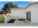 Back patio featuring a unique fountain, tiled area and convenient sliding glass door access to the home's interior at 11569 Sw 71St Cir, Ocala, FL 34476