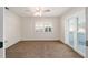 Bedroom with natural light from window and sliding glass doors, and neutral walls at 11569 Sw 71St Cir, Ocala, FL 34476