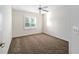 Bedroom with neutral walls, carpeted floors, and natural light at 11569 Sw 71St Cir, Ocala, FL 34476