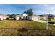 Picturesque single-story home featuring a verdant lawn and a functional two-car garage, providing a serene residential setting at 11569 Sw 71St Cir, Ocala, FL 34476