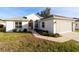 Inviting single-story home with well-maintained lawn, featuring a two-car garage and classic architectural details at 11569 Sw 71St Cir, Ocala, FL 34476