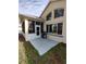 Exterior view of home with screened-in porch, open patio, and lush green lawn at 11663 Sw 72Nd Cir, Ocala, FL 34476