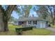 Charming single-story home with mature landscaping and an attached garage at 1225 Se 16Th St, Ocala, FL 34471