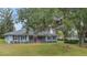 Charming single-story home with mature landscaping and a welcoming front porch at 1225 Se 16Th St, Ocala, FL 34471