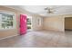 Bright living room with tile floors and a view of the landscaped front yard at 1225 Se 16Th St, Ocala, FL 34471