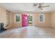 Bright living room with tile floors and a view of the landscaped front yard at 1225 Se 16Th St, Ocala, FL 34471