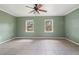 Spacious living room featuring tile floors, neutral-toned walls, and a ceiling fan at 1225 Se 16Th St, Ocala, FL 34471