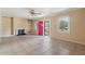 Bright living room with tile floors and a view of the landscaped front yard at 1225 Se 16Th St, Ocala, FL 34471