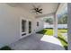 The covered patio features a modern ceiling fan and provides a great space for outdoor entertaining and relaxation at 12882 Se 42Nd Ct, Belleview, FL 34420