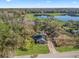 Beautiful aerial view of home and property, lush greenery, nestled among serene trees, and a lake at 16211 Se 62Nd Pl, Ocklawaha, FL 32179