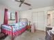 Cozy bedroom featuring carpet flooring, ceiling fan, and natural light from the exterior window at 16211 Se 62Nd Pl, Ocklawaha, FL 32179