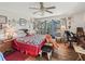 Inviting bedroom featuring a ceiling fan, wood floors and plenty of natural light at 16211 Se 62Nd Pl, Ocklawaha, FL 32179