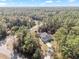 Aerial view of home located in a heavily wooded area at 18301 Sw 69Th Loop, Dunnellon, FL 34432