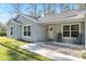 Inviting front porch with rocking chairs and 'Welcome' sign, creating a warm and friendly ambiance at 18301 Sw 69Th Loop, Dunnellon, FL 34432